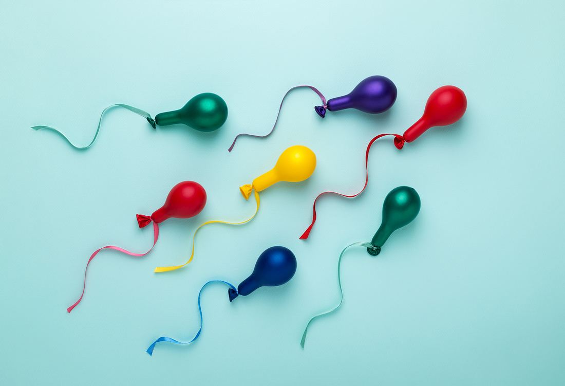 ewegung der bunten Luftballons in Spermie Shape-Konzept.