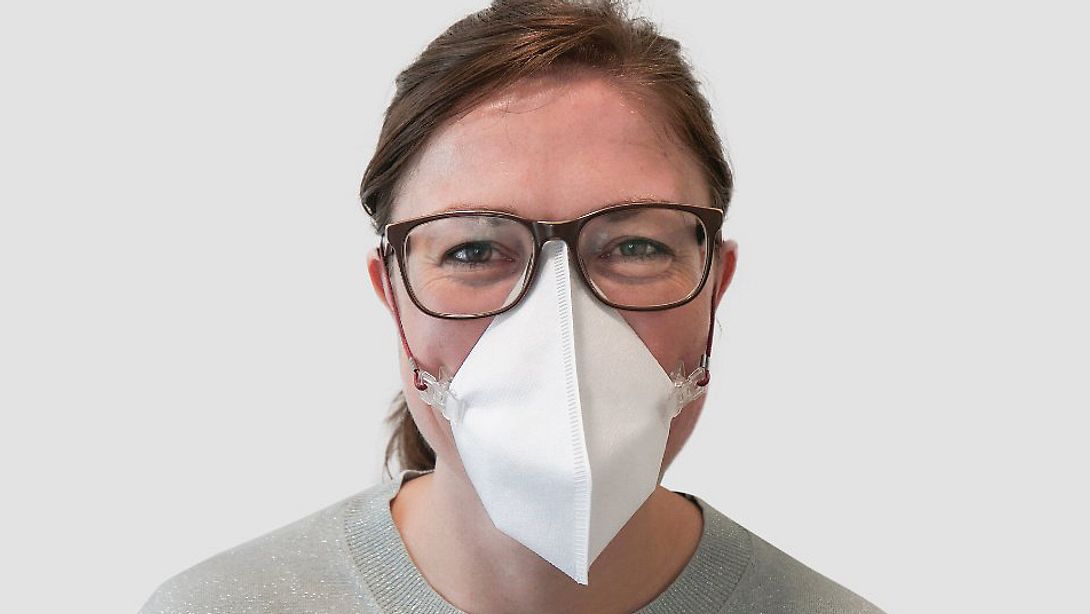 Frau trägt Virusmaske von Melitta - Foto: Melitta
